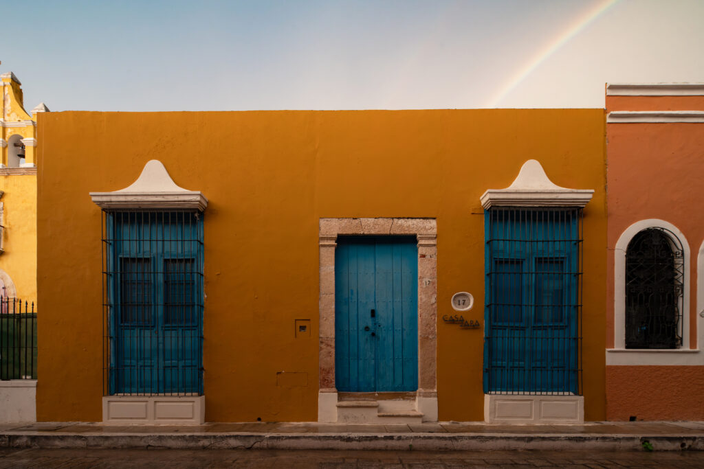 Casa Japa colonial facade in Campeche — terracotta walls and blue shutters in the historic center